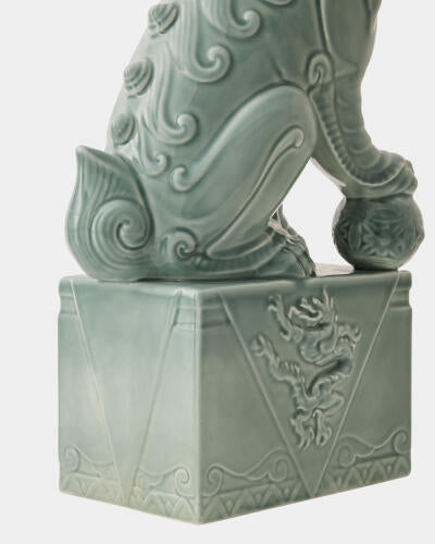 Carved base detail of the blue Foo Dog sculpture