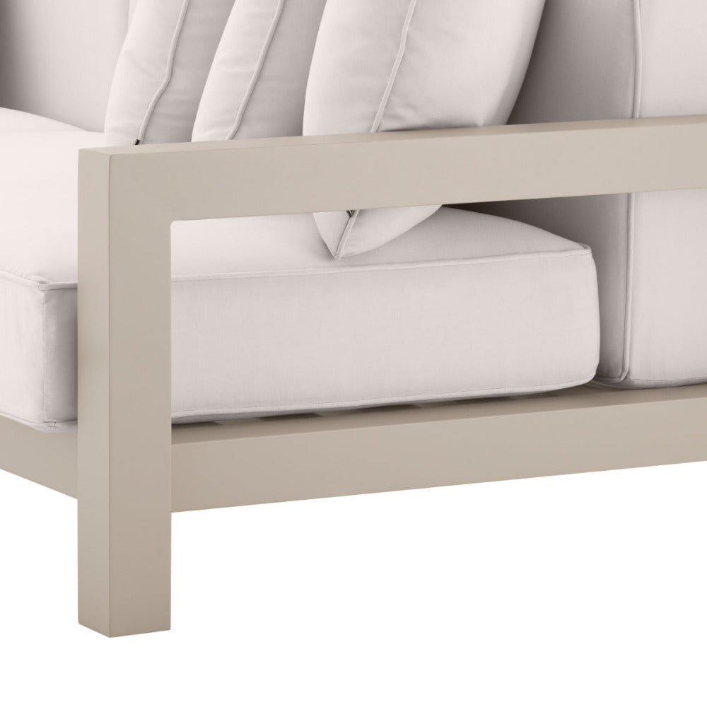 Close-up of a beige outdoor sofa with white cushions on a white background