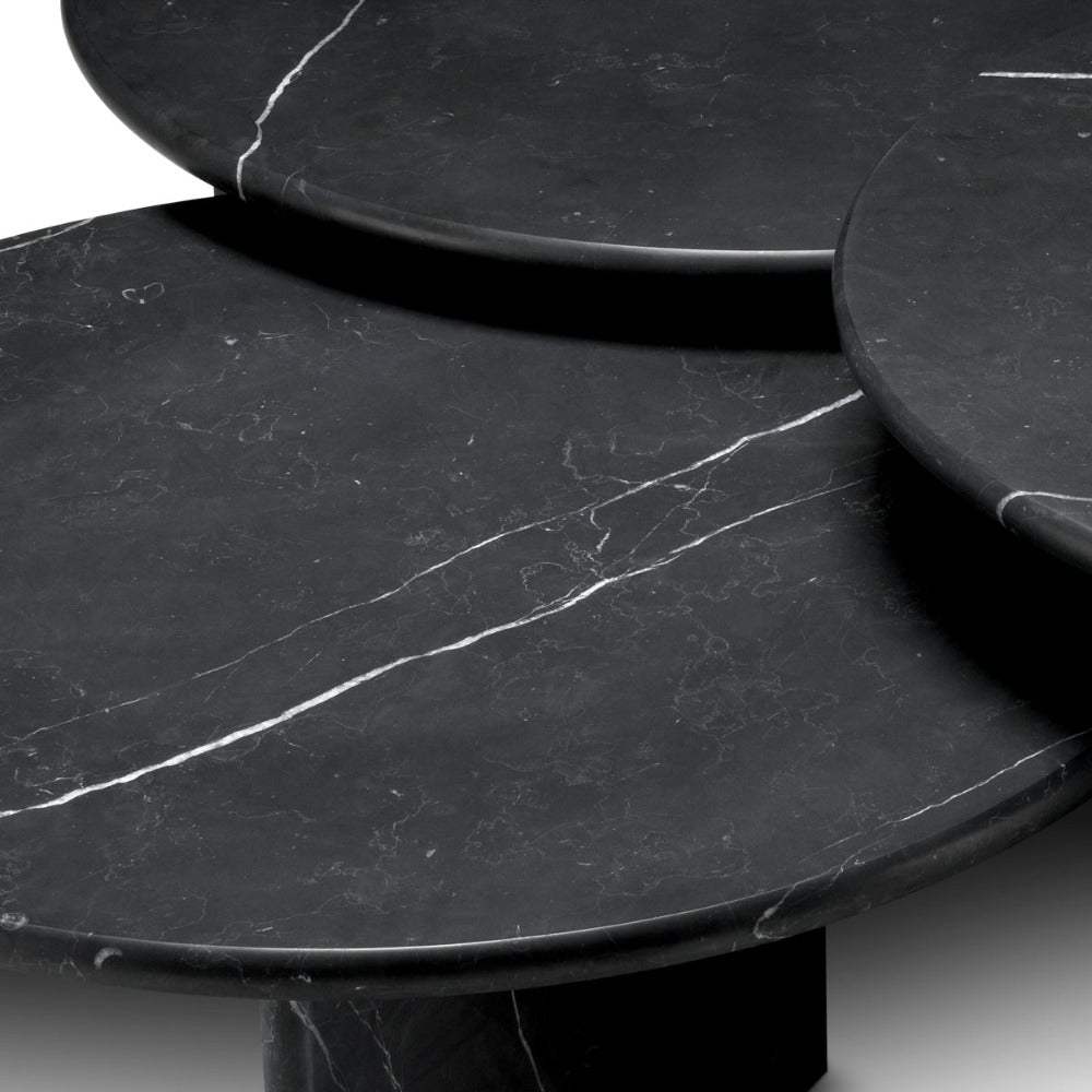 Black marble table with a smooth surface and subtle veining.