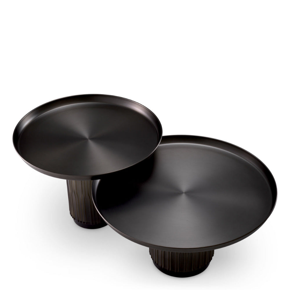 Two black coffee tables with round tops and cylindrical bases on a white background