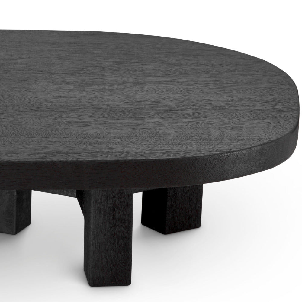 Round black table with thick legs on a white background