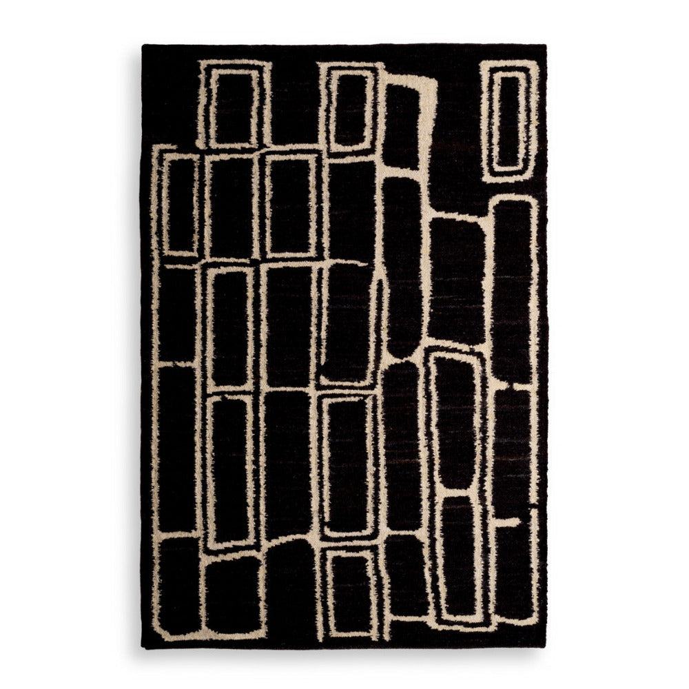 Black and white geometric patterned rug on a white background