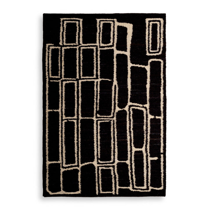 Black and white geometric patterned rug on a white background