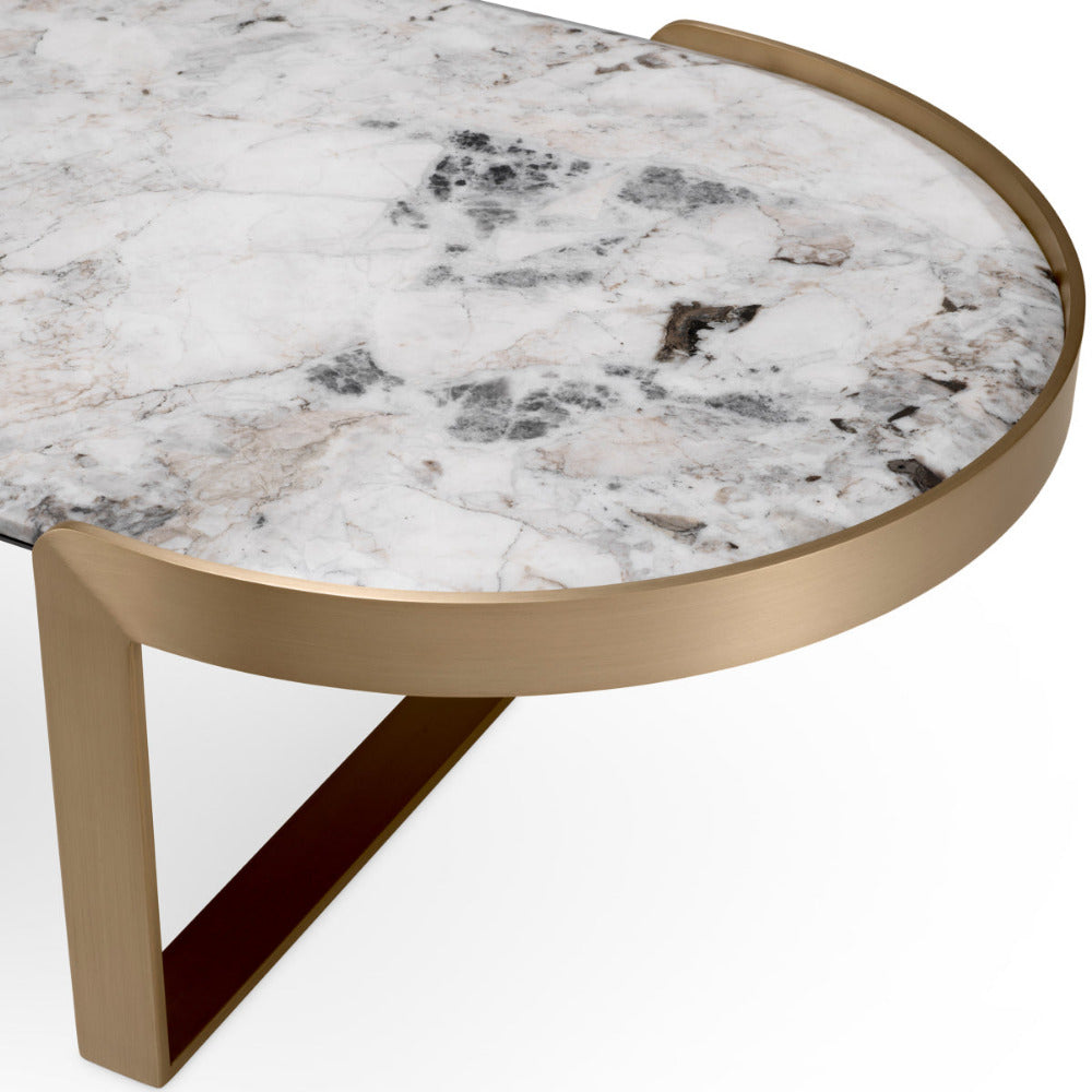 Round marble coffee table with a gold base on a white background