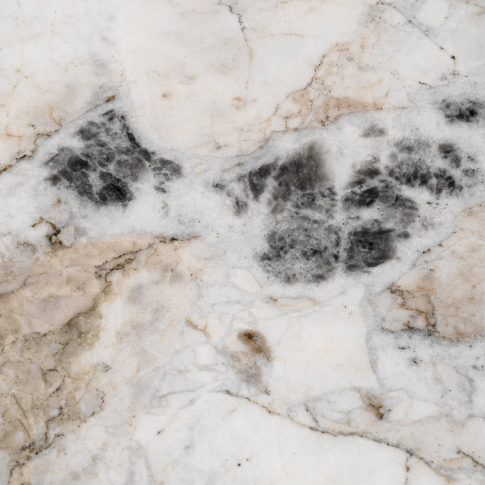 Close-up of a marble surface with beige, white, and black patterns