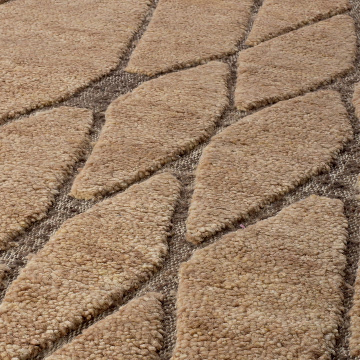 Close-up of a textured beige carpet with a diamond pattern