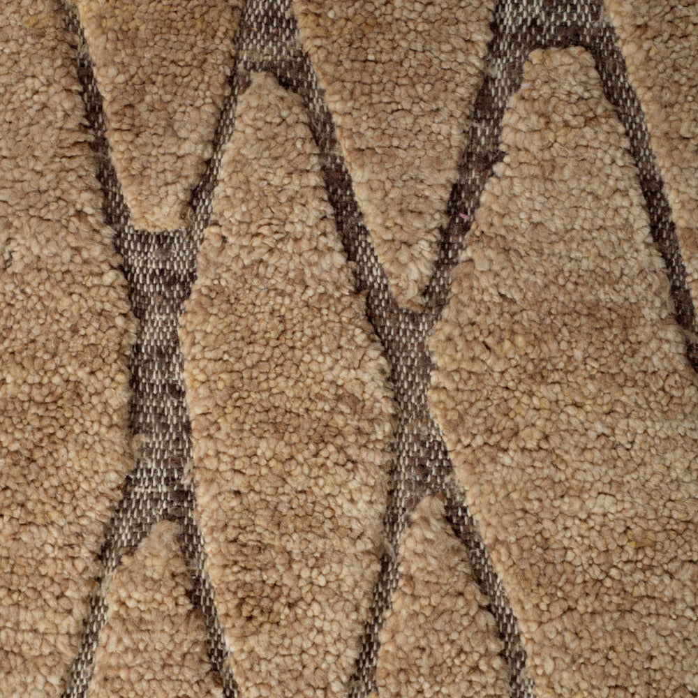 Close-up of textured brown carpet with geometric pattern