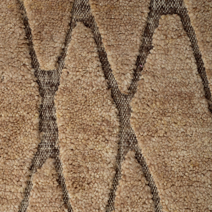 Close-up of textured brown carpet with geometric pattern