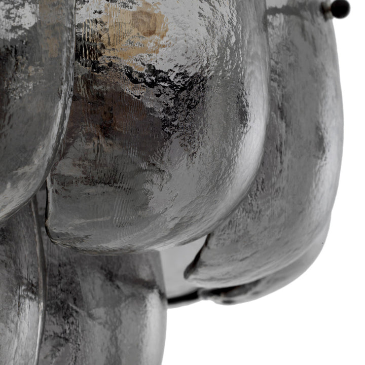 Close-up of grey glass chandelier on a white background