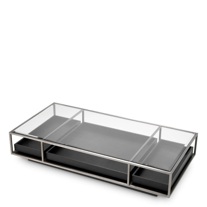 Modern coffee table with glass top and metal frame on a white background