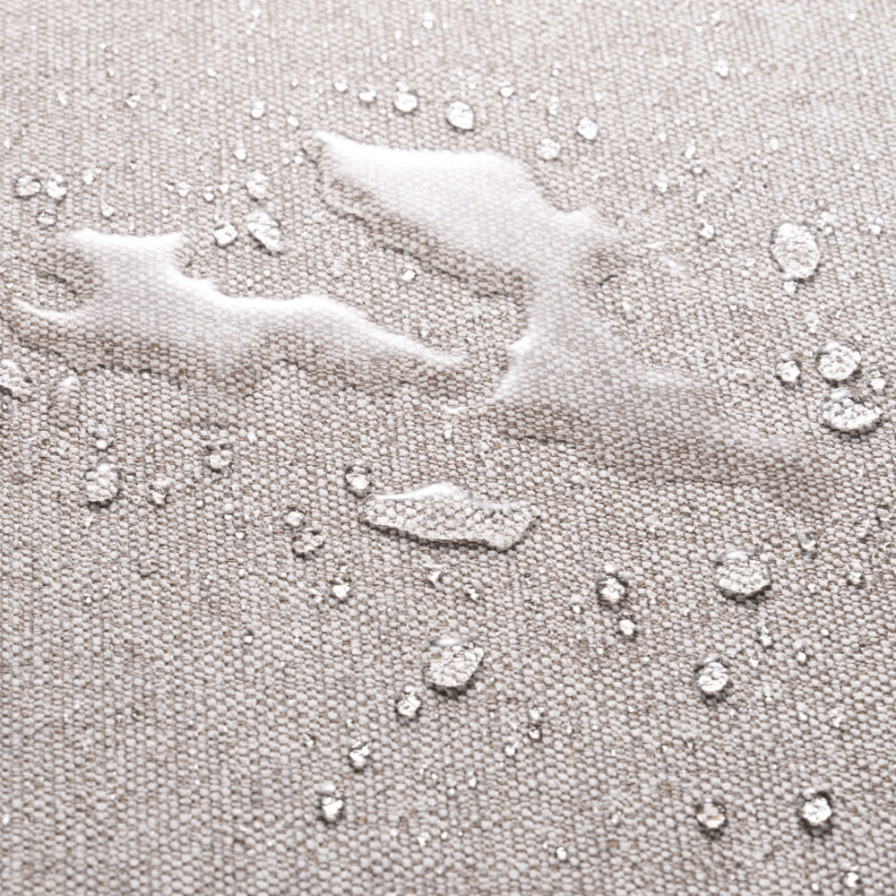 Close-up of a textured gray surface with water