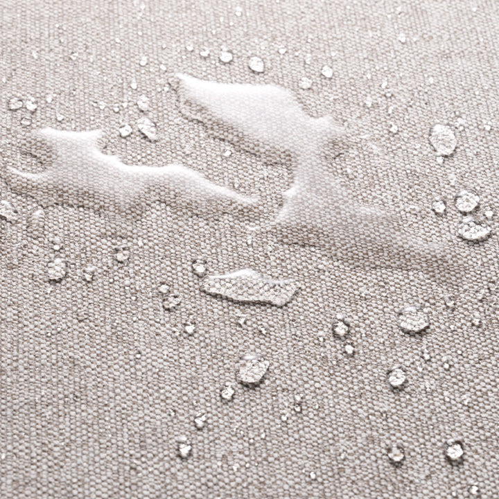 Close-up of a textured gray surface with water