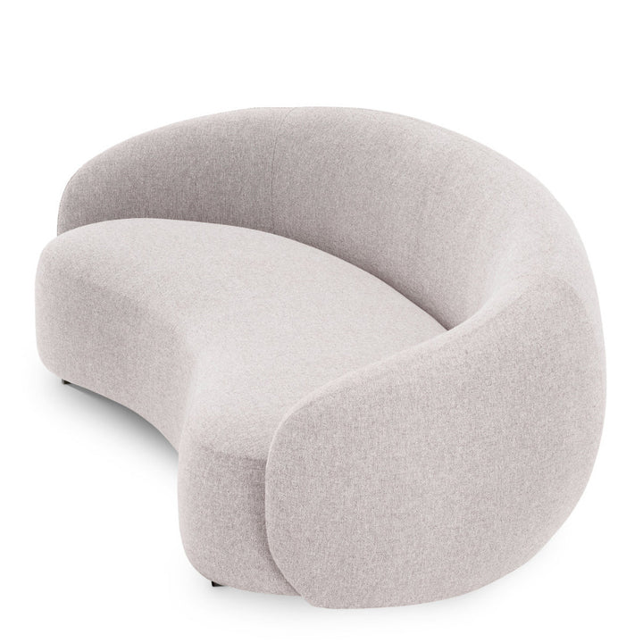 Modern gray sofa with a curved design on a white background
