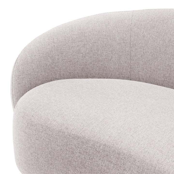 Close-up of a gray upholstered sofa with a textured fabric finish.