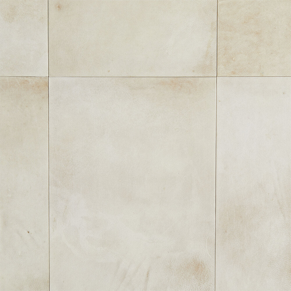 Beige tiles with a subtle pattern on a beige background