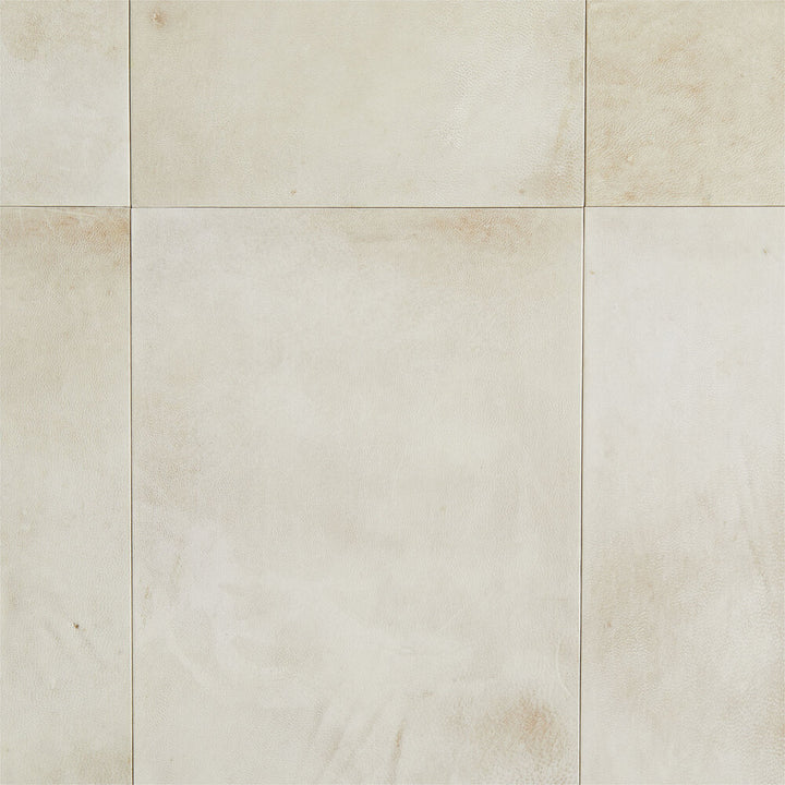 Beige tiles with a subtle pattern on a beige background