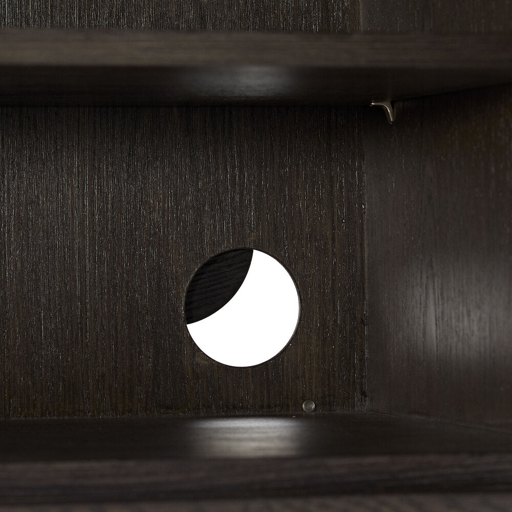 Dark wooden surface with a circular cutout revealing a white light inside