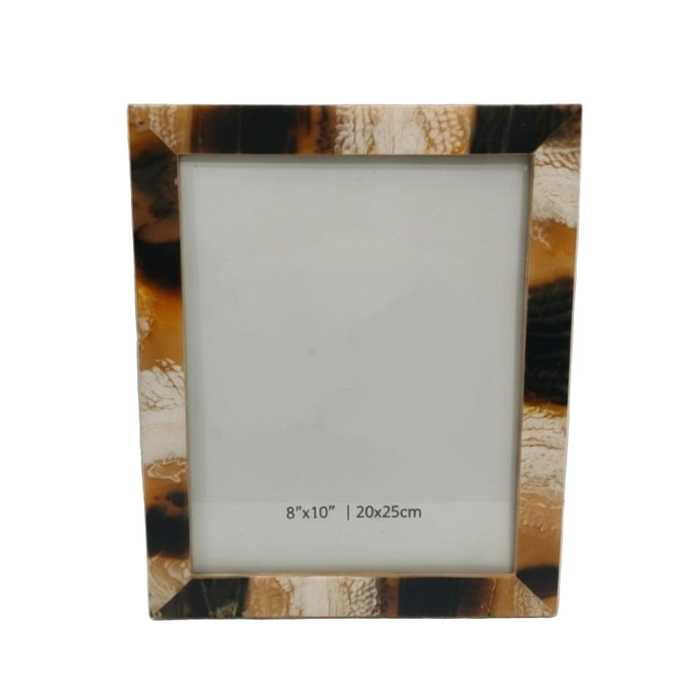 Tortoiseshell patterned photo frame on a light gray background