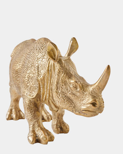 Three-quarter view of the brass rhino sculpture