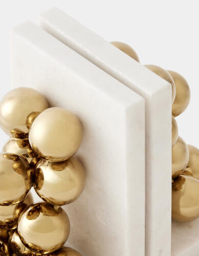 Close-up of the plated brass finish on the sphere bookends