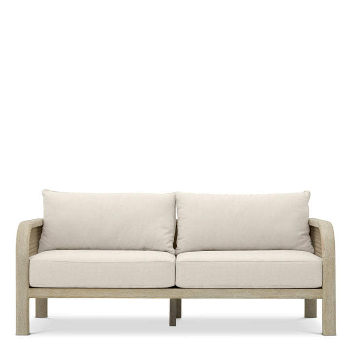 Beige outdoor sofa with light wooden frame on a white background