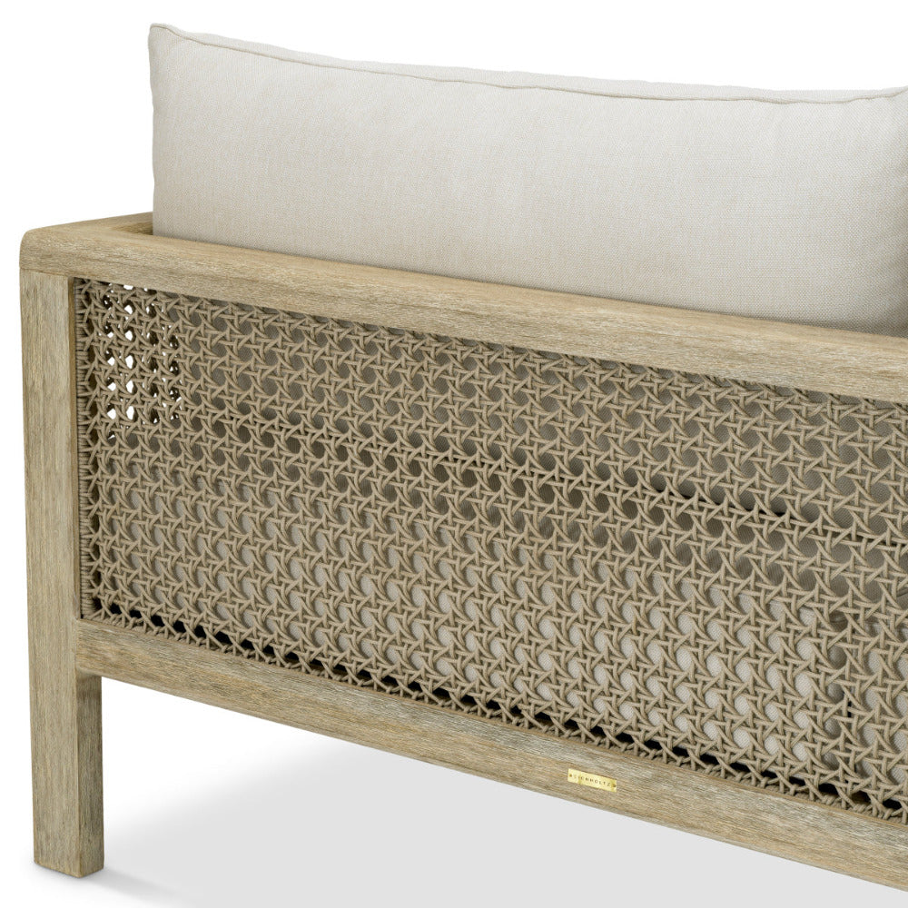 Wooden bench with woven backrest and white cushion on a white background