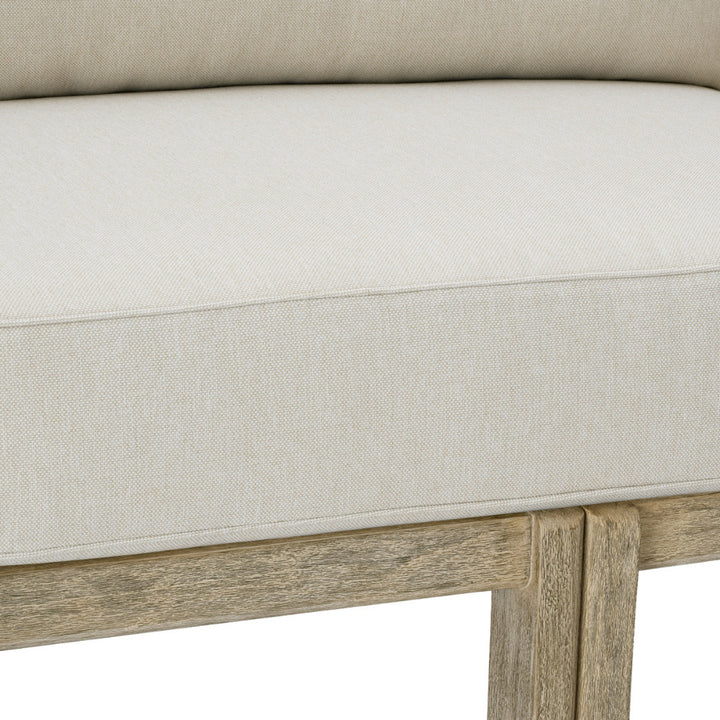 Close-up of a beige cushioned chair with wooden legs on a white background