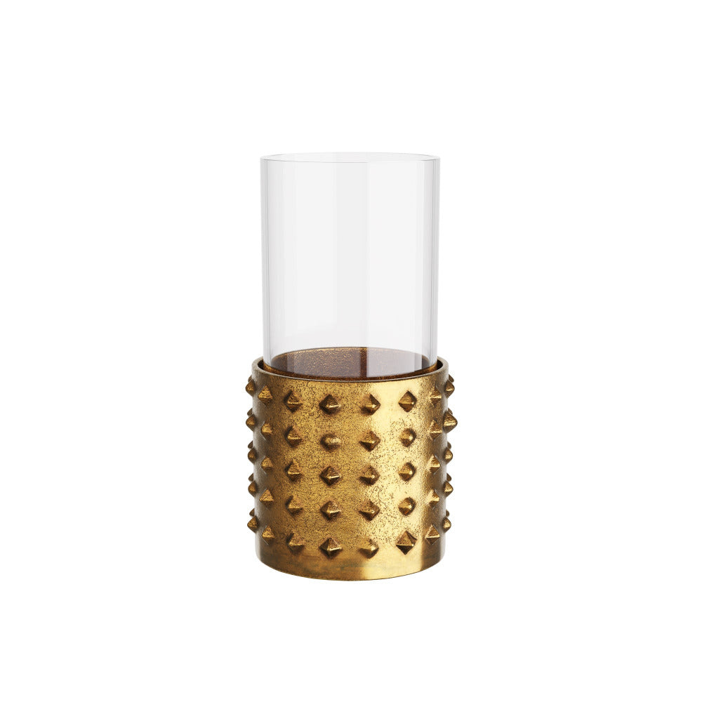 Golden candle holder with spike design on a white background