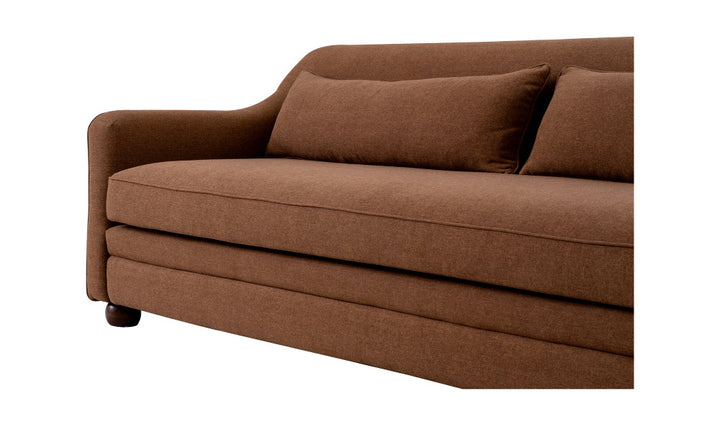Brown sofa with two cushions on a white background