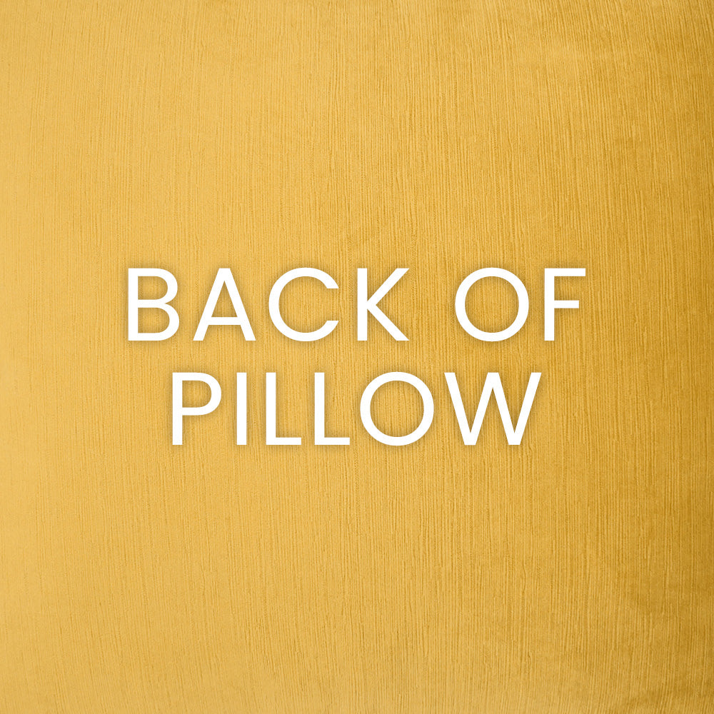 Banksy Honey pillows styled on a sofa