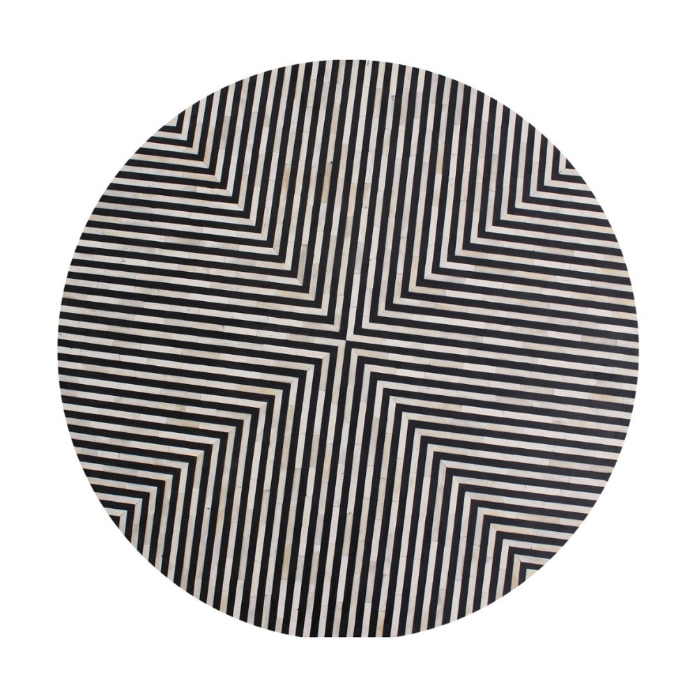 Top view of a circular side table with black and white striped pattern on a white background