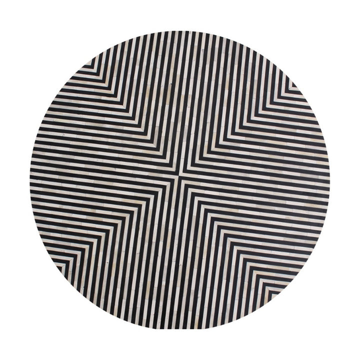 Top view of a circular side table with black and white striped pattern on a white background