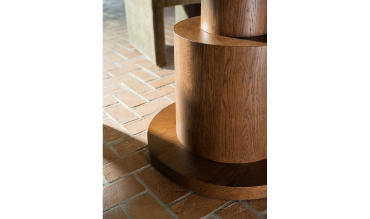 Wooden table base on a brick floor