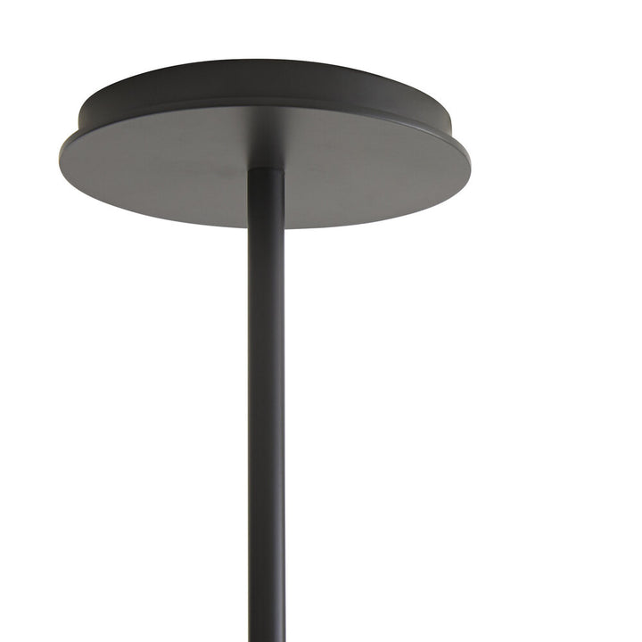 Black cylindrical pendant light fixture on a white background