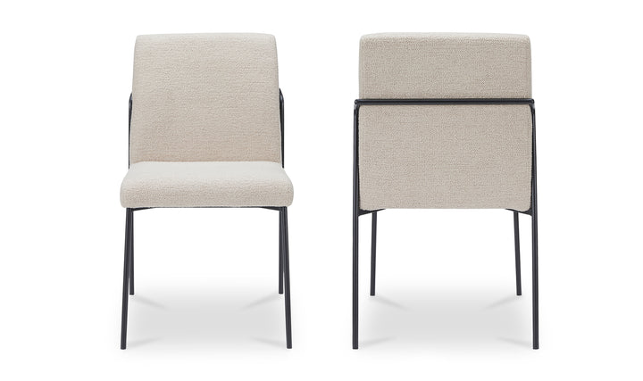 Two ivory chairs with black frames on a white background