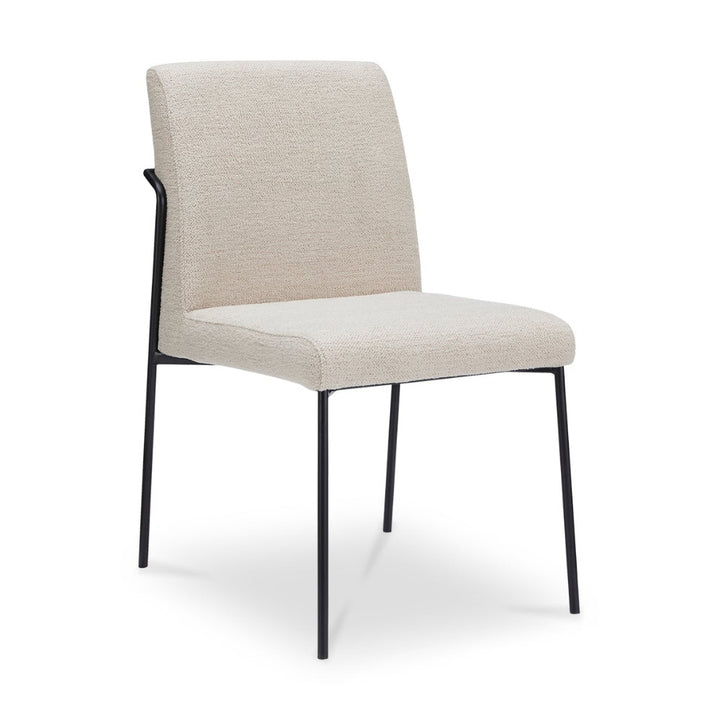 Ivory chair with black legs on a white background