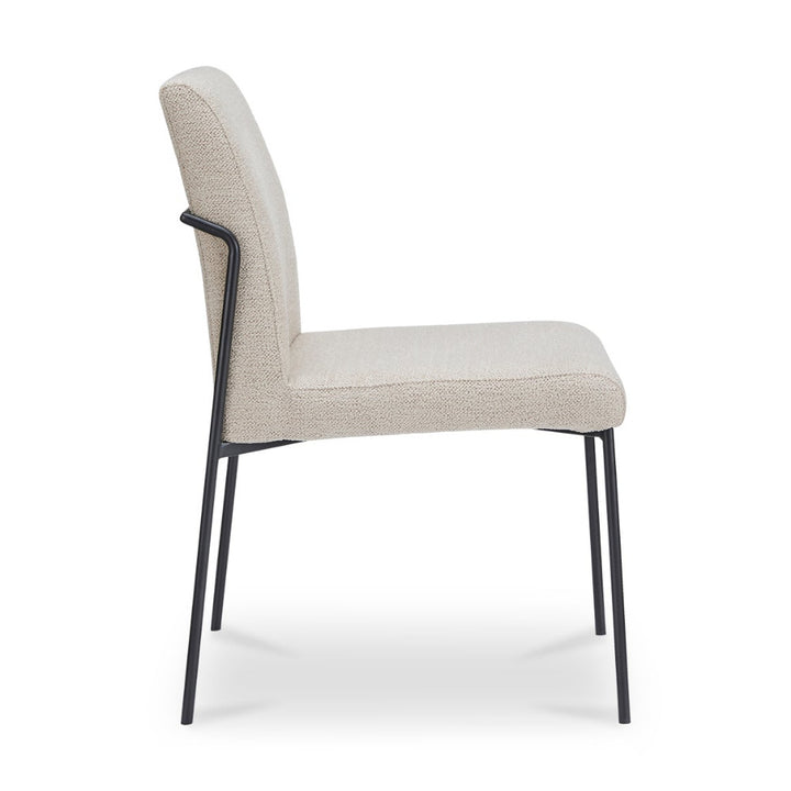 Ivory chair with black legs on a white background