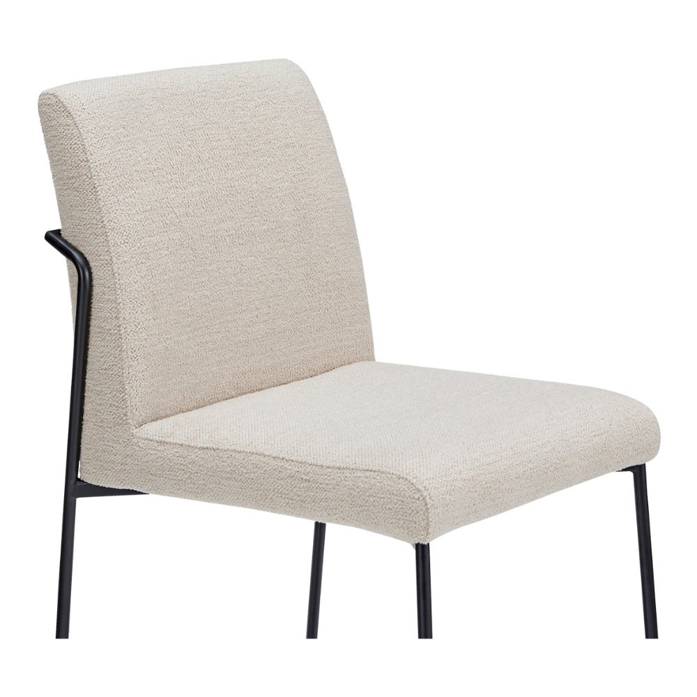 Ivory chair with black legs on a white background