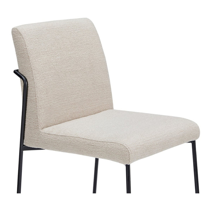 Ivory chair with black legs on a white background
