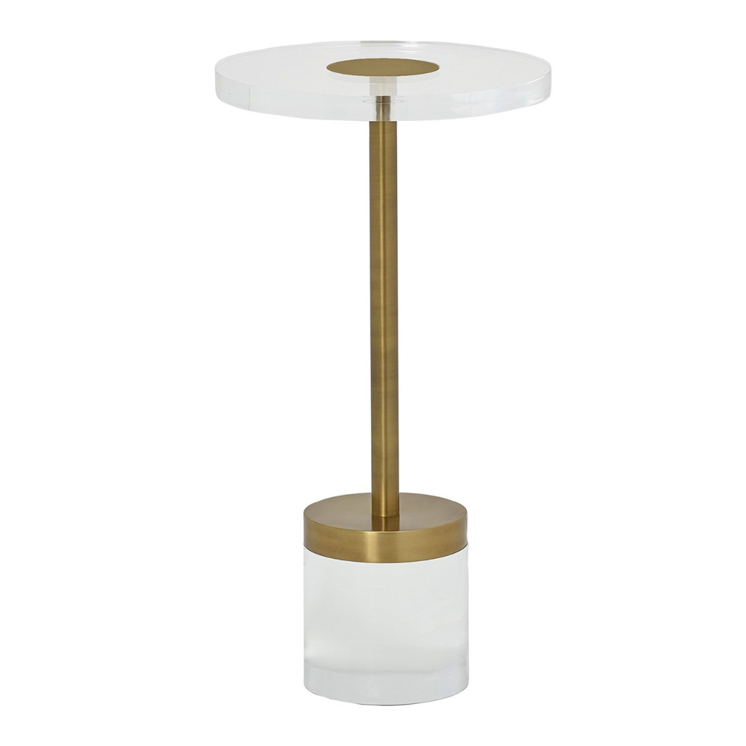 Decorative lamp with white shade and gold base on a white background