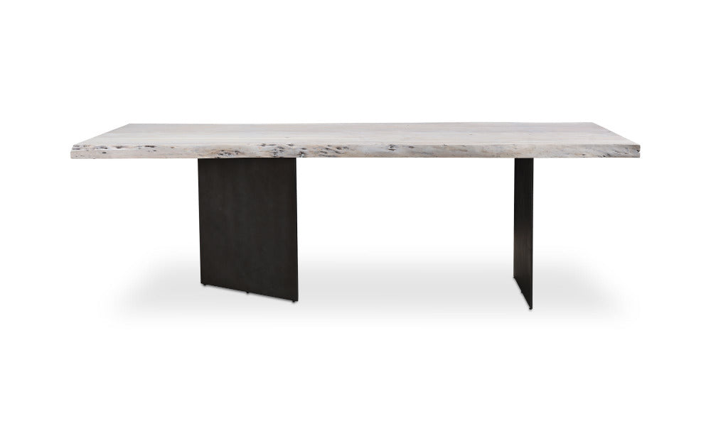 Dining table with wood top and black metal legs on a white background