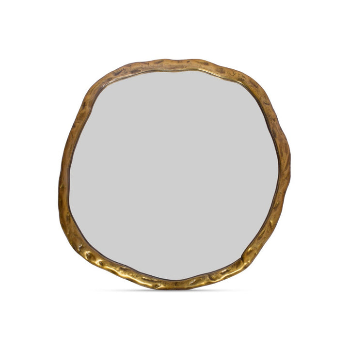 Round mirror with a gold frame on a white background