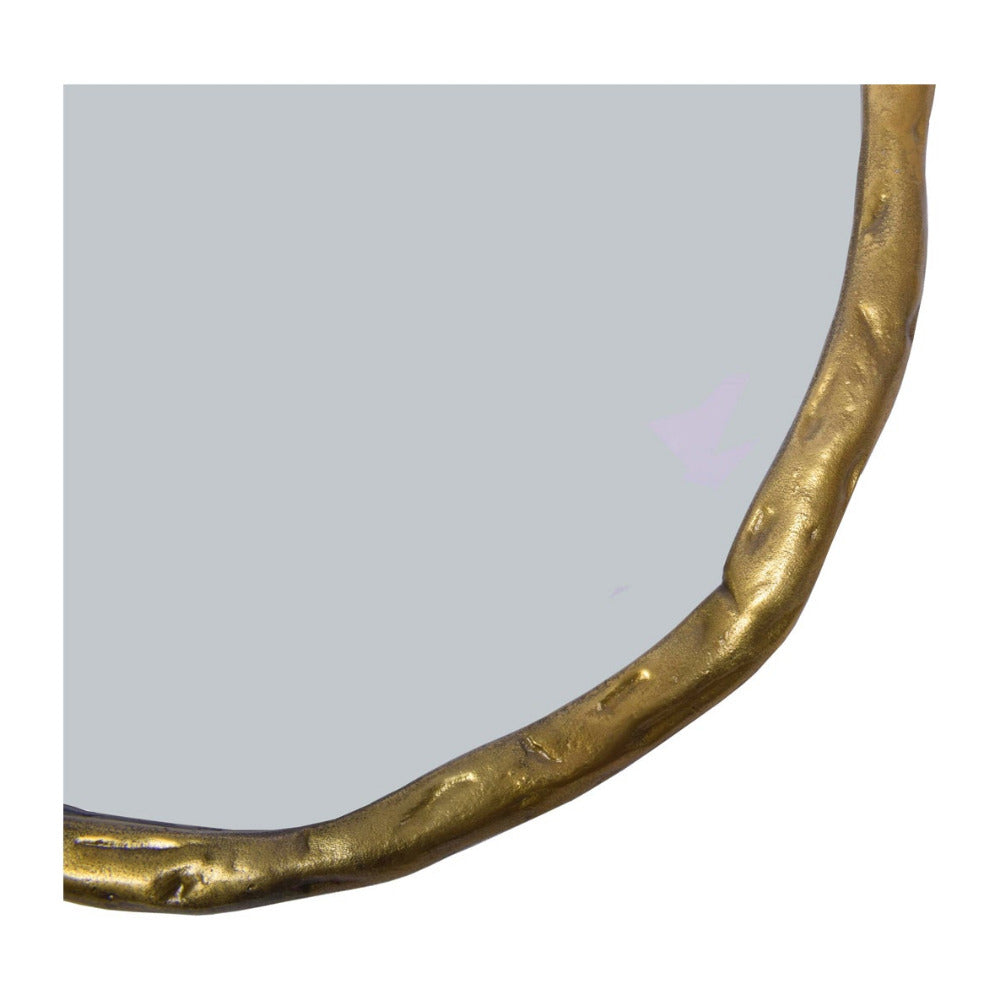 Round mirror with a gold frame on a white background