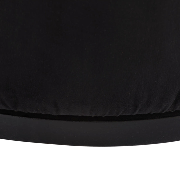 Close-up of a black seat cover on a white background