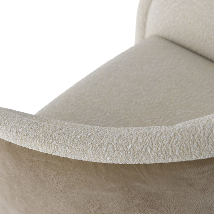 Close-up of a textured beige sofa corner on a white background