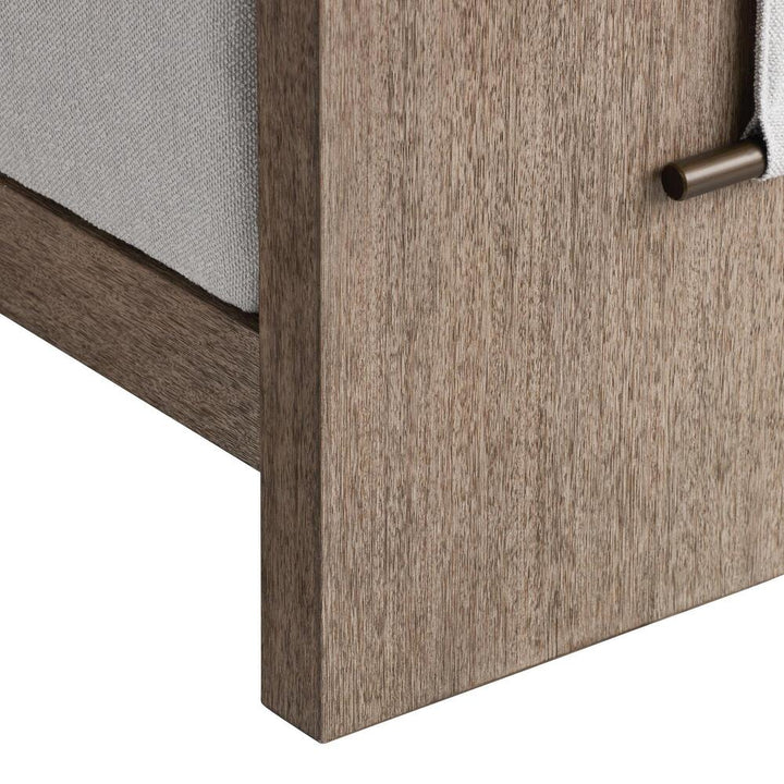 Close-up of a wooden daybed frame on a white background