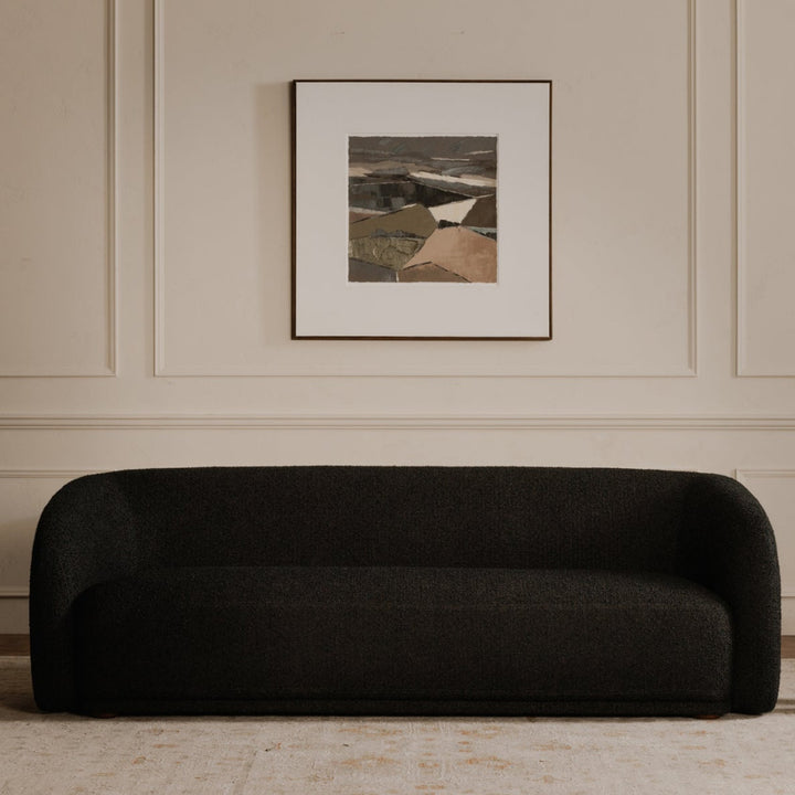 Living room with a black sofa