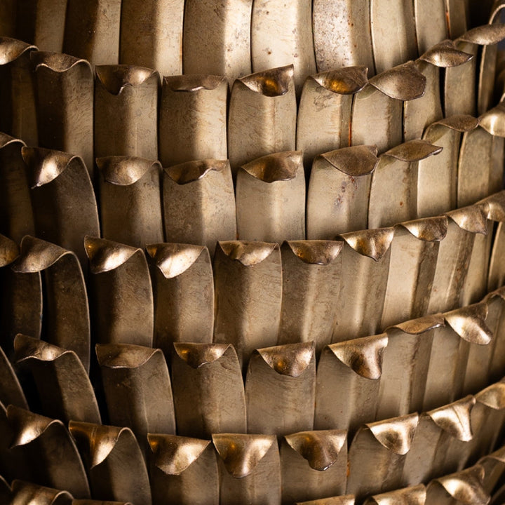 Close-up of a textured metal surface with wavy patterns