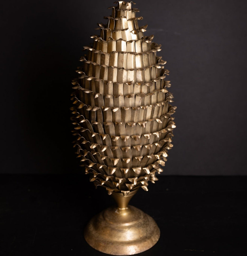 Decorative gold tree sculpture on a black background