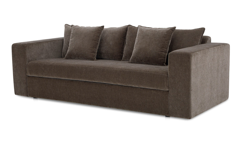 Brown sofa with four cushions on a white background